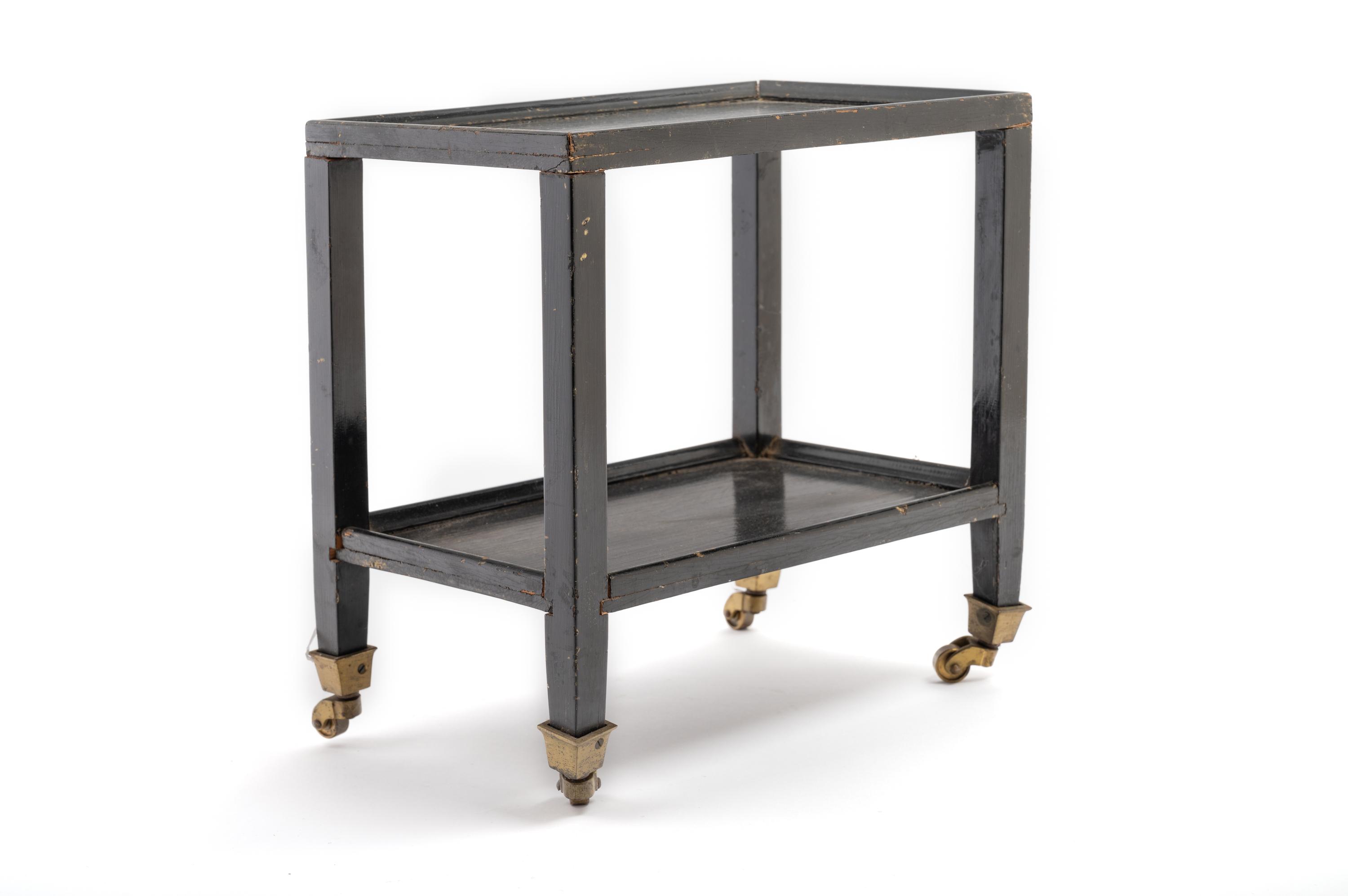 A Black Painted "Telephone Table" in the Style of Karl Springer