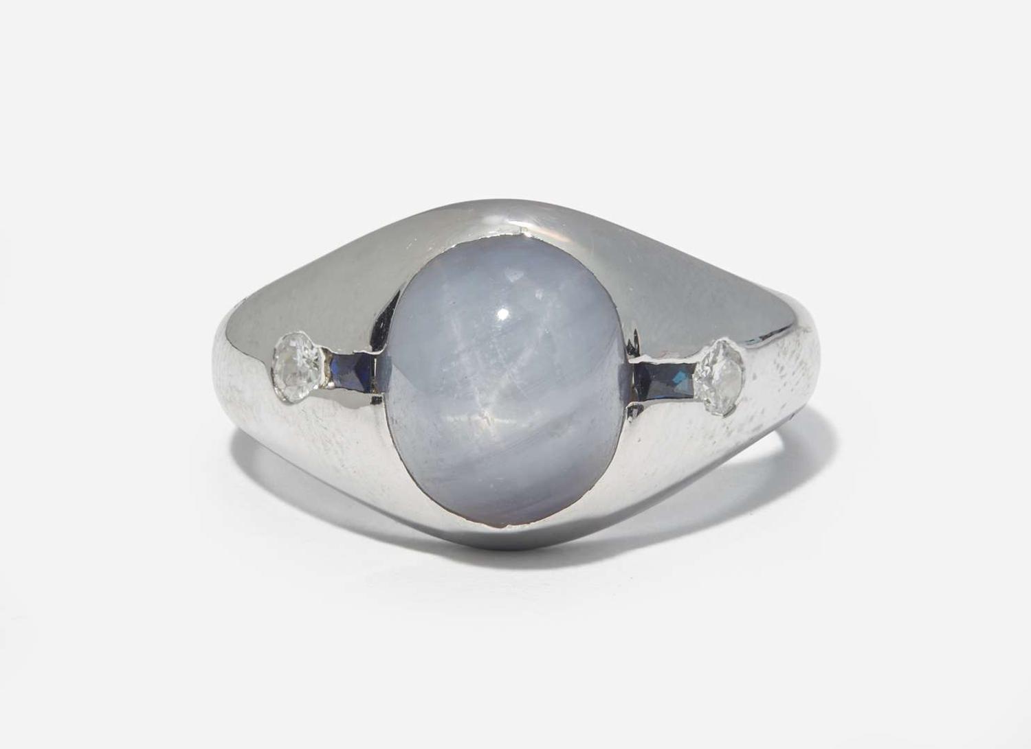 A 20K White Gold, Star Sapphire, and Diamond Ring