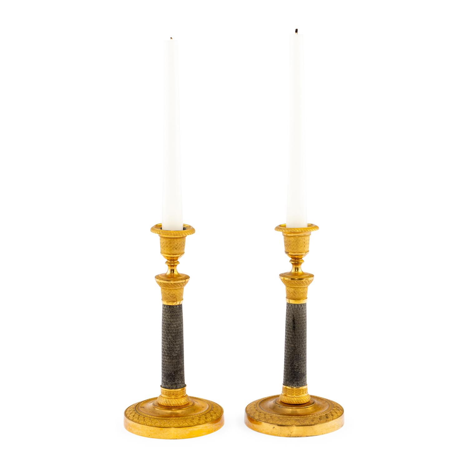 A Pair of Continental Gilt and Patinated Bronze Candlesticks