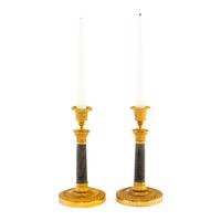 A Pair of Continental Gilt and Patinated Bronze Candlesticks