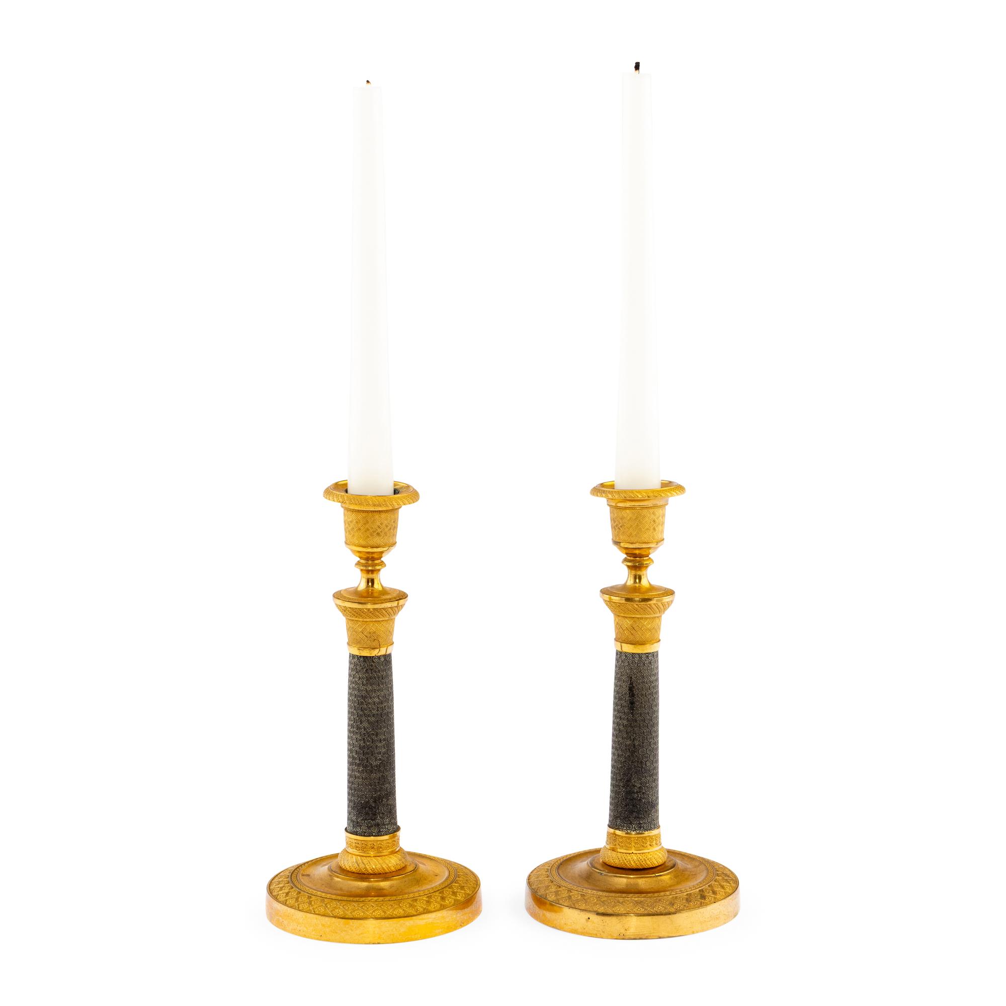 A Pair of Continental Gilt and Patinated Bronze Candlesticks