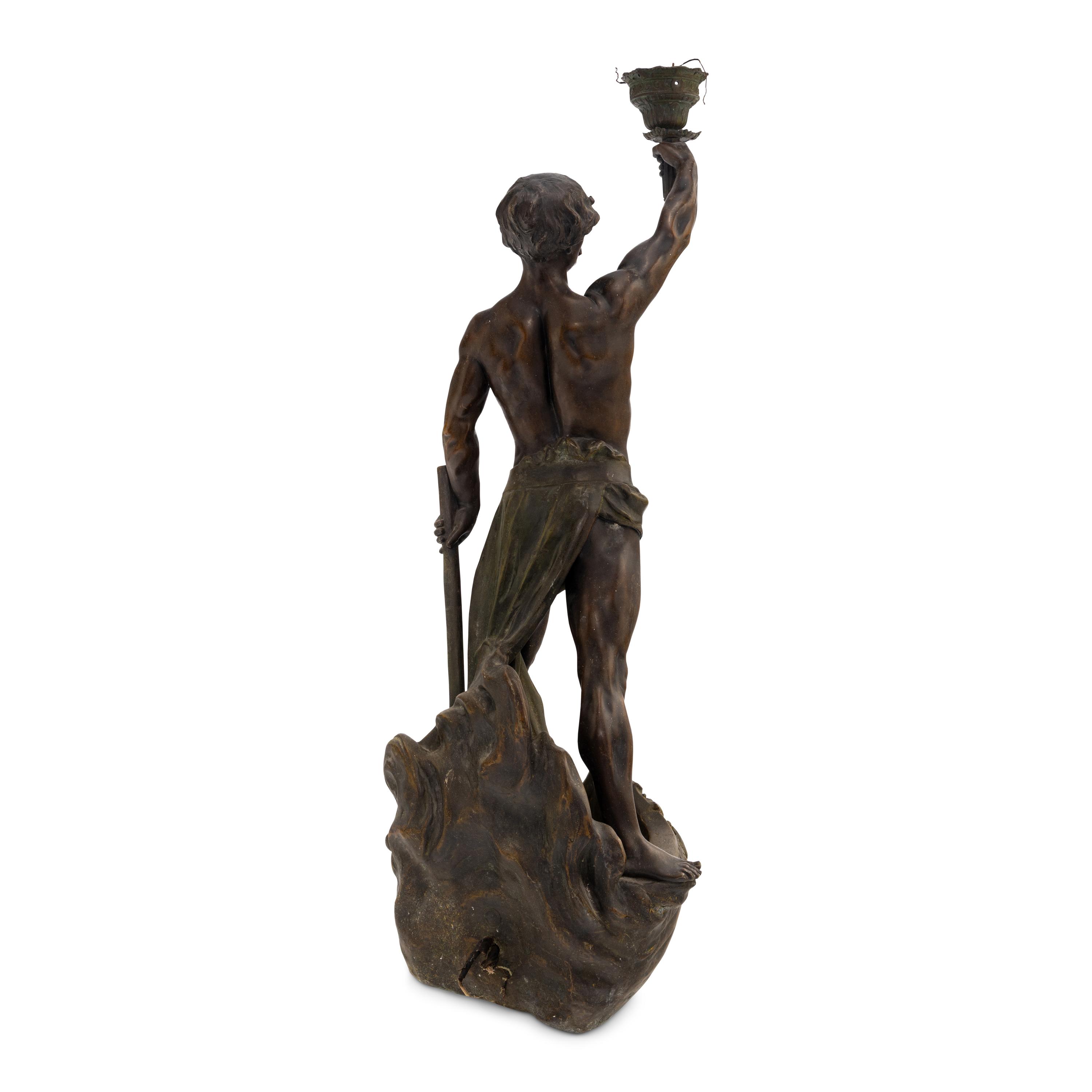 A Cast Metal Figural Newel Post Lamp