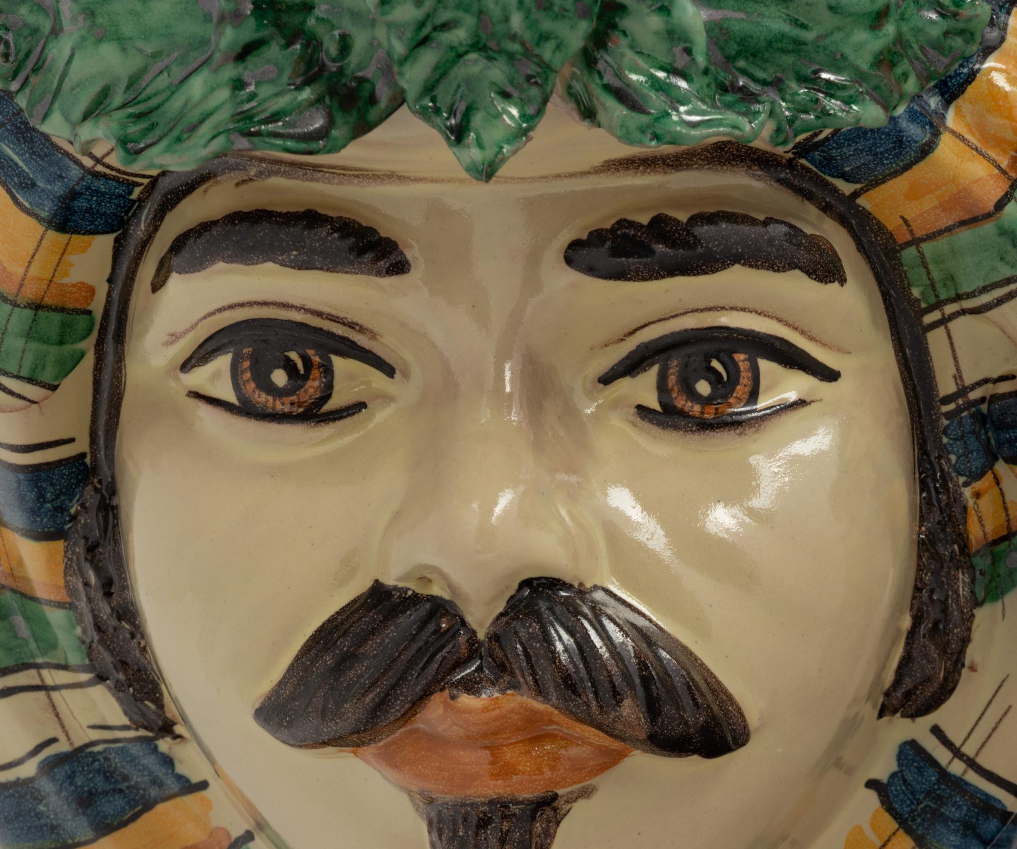 A Pair of Italian Polychrome Glazed Pottery Figural Vases