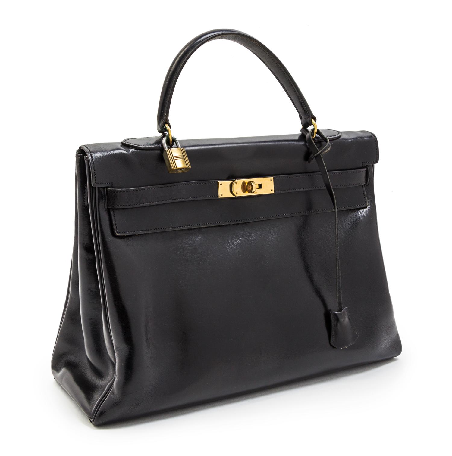 An Hermes 35cm Black Leather Kelly Bag, 13 1/2 x 9 1/2 x 5 inches.