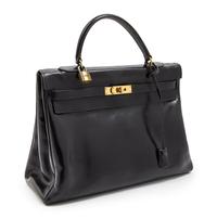 An Hermes 35cm Black Leather Kelly Bag, 13 1/2 x 9 1/2 x 5 inches.