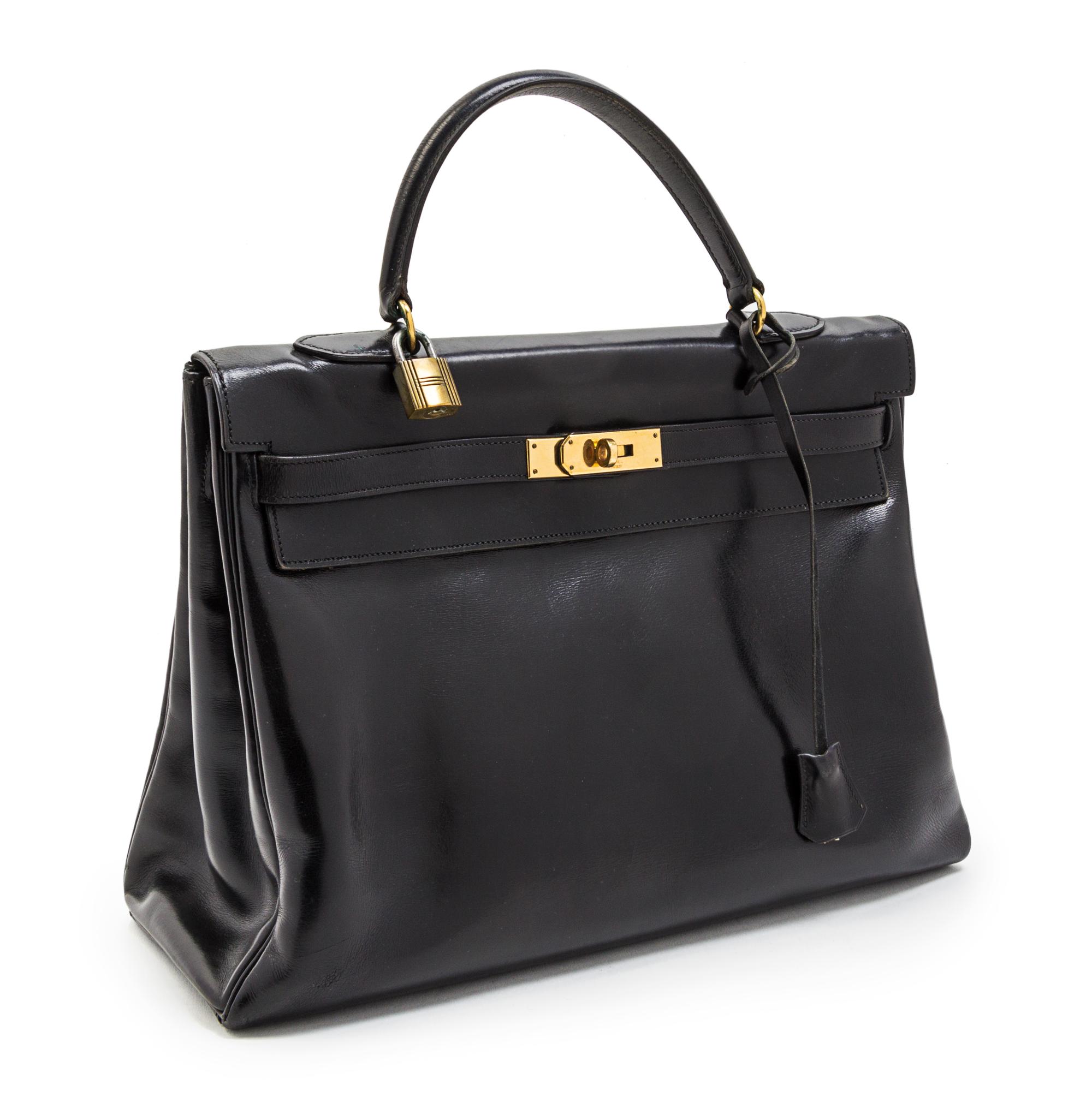 An Hermes 35cm Black Leather Kelly Bag, 13 1/2 x 9 1/2 x 5 inches.