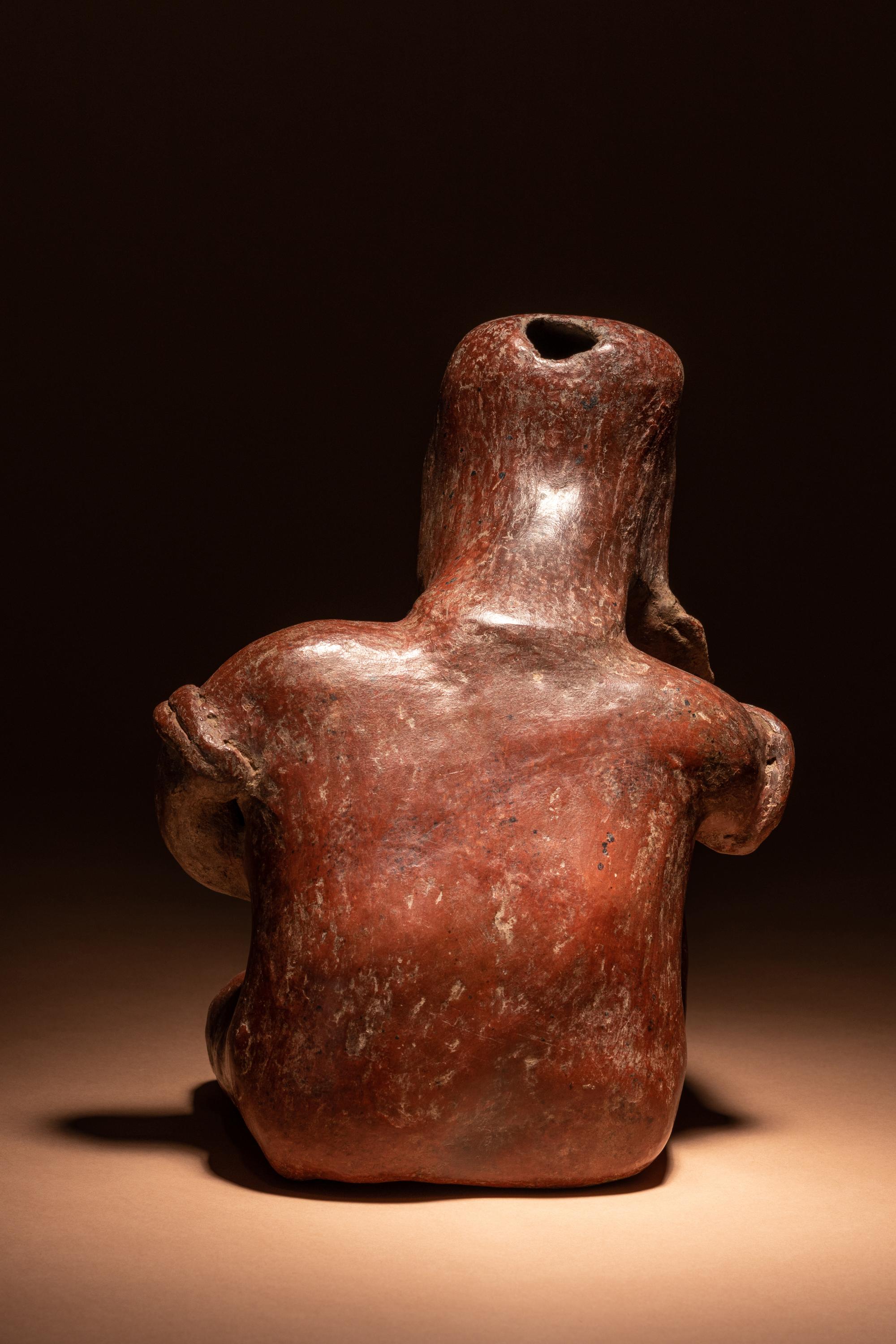 A Colima Terracotta Seated Male Figure