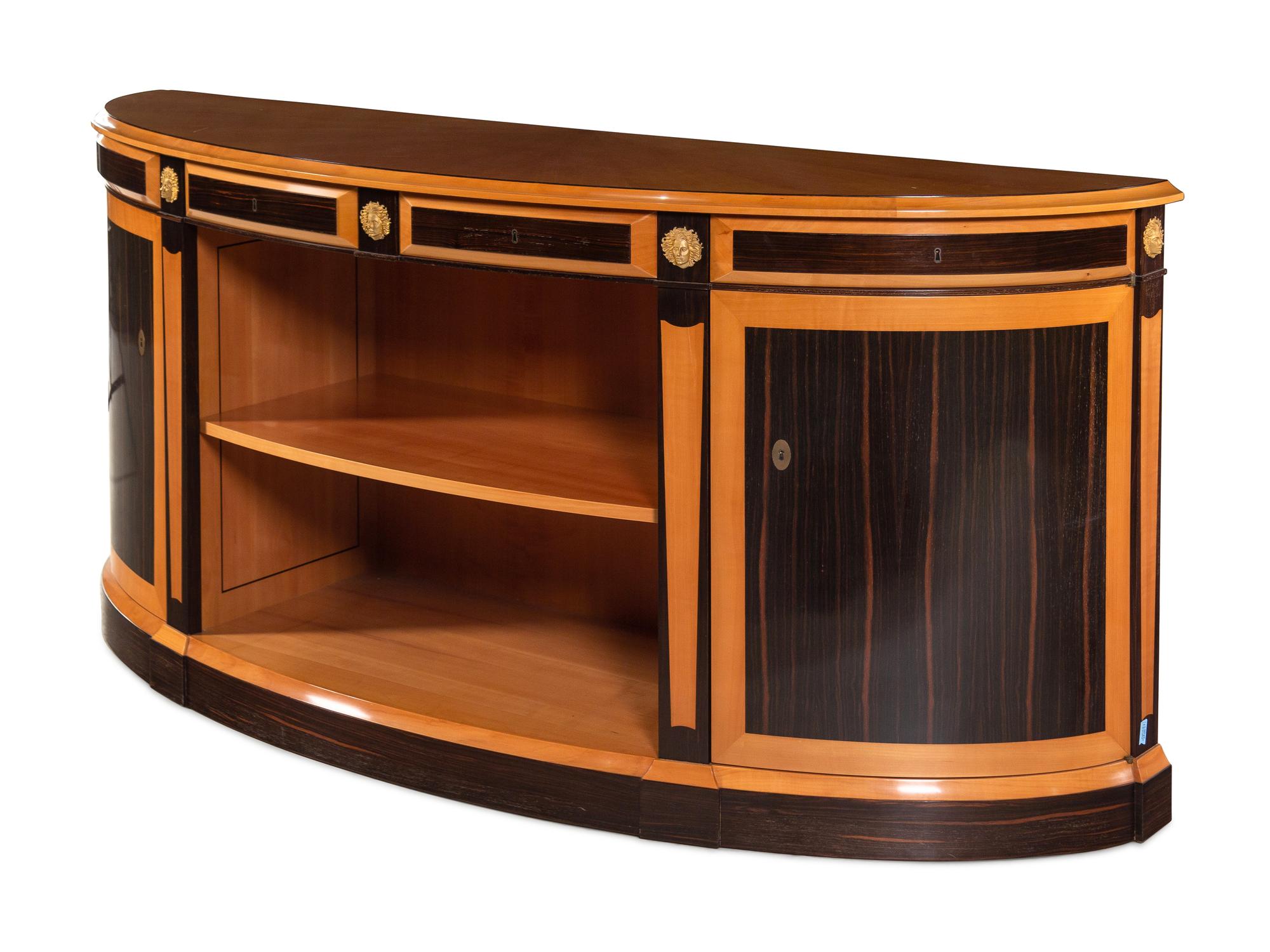 A Custom Gilt Bronze Mounted Part-Ebonized Satinwood Demilune Cabinet