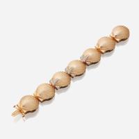 A fourteen karat gold and diamond bracelet watch, J. Schulz