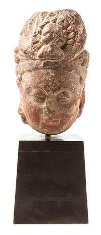 A Southeast Asian Stone Head of a Boddhisattva Height 14 1/4 inches.