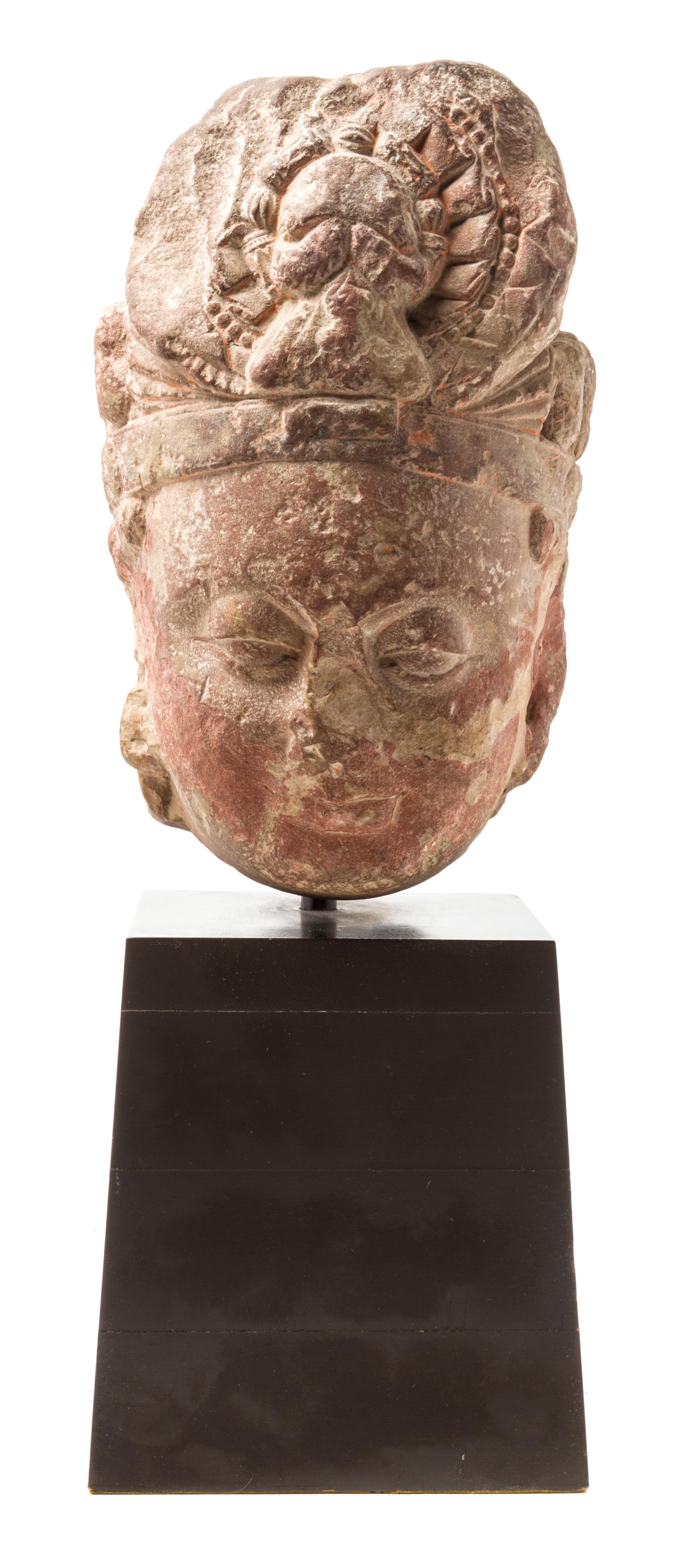 A Southeast Asian Stone Head of a Boddhisattva Height 14 1/4 inches.