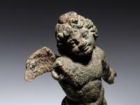 A Roman Bronze Figure of Eros