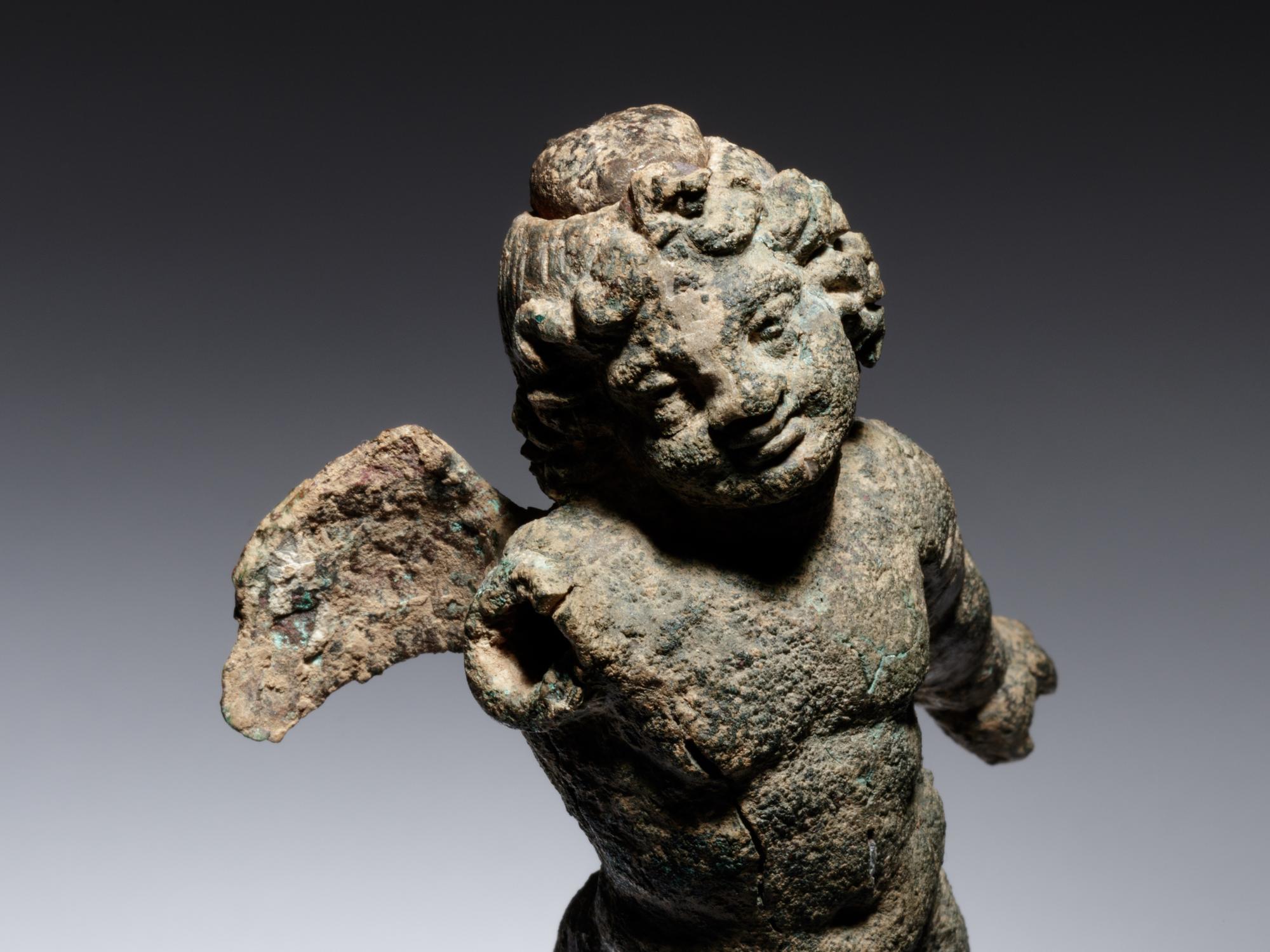 A Roman Bronze Figure of Eros