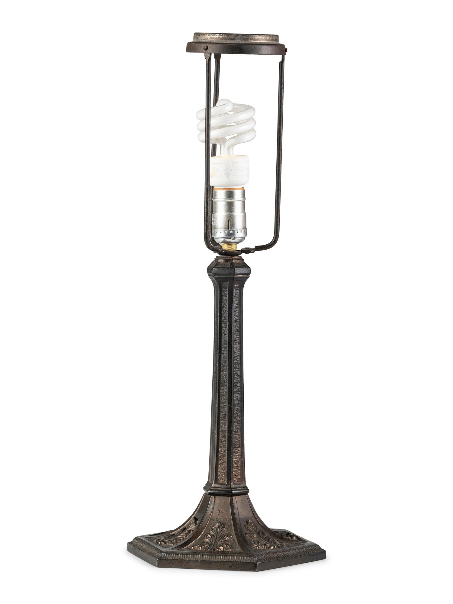 A Cast Iron and Slag Glass Table Lamp