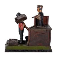 A Shephard Hardware Excelsior Series 'Mason' Cast Iron Mechanical Bank