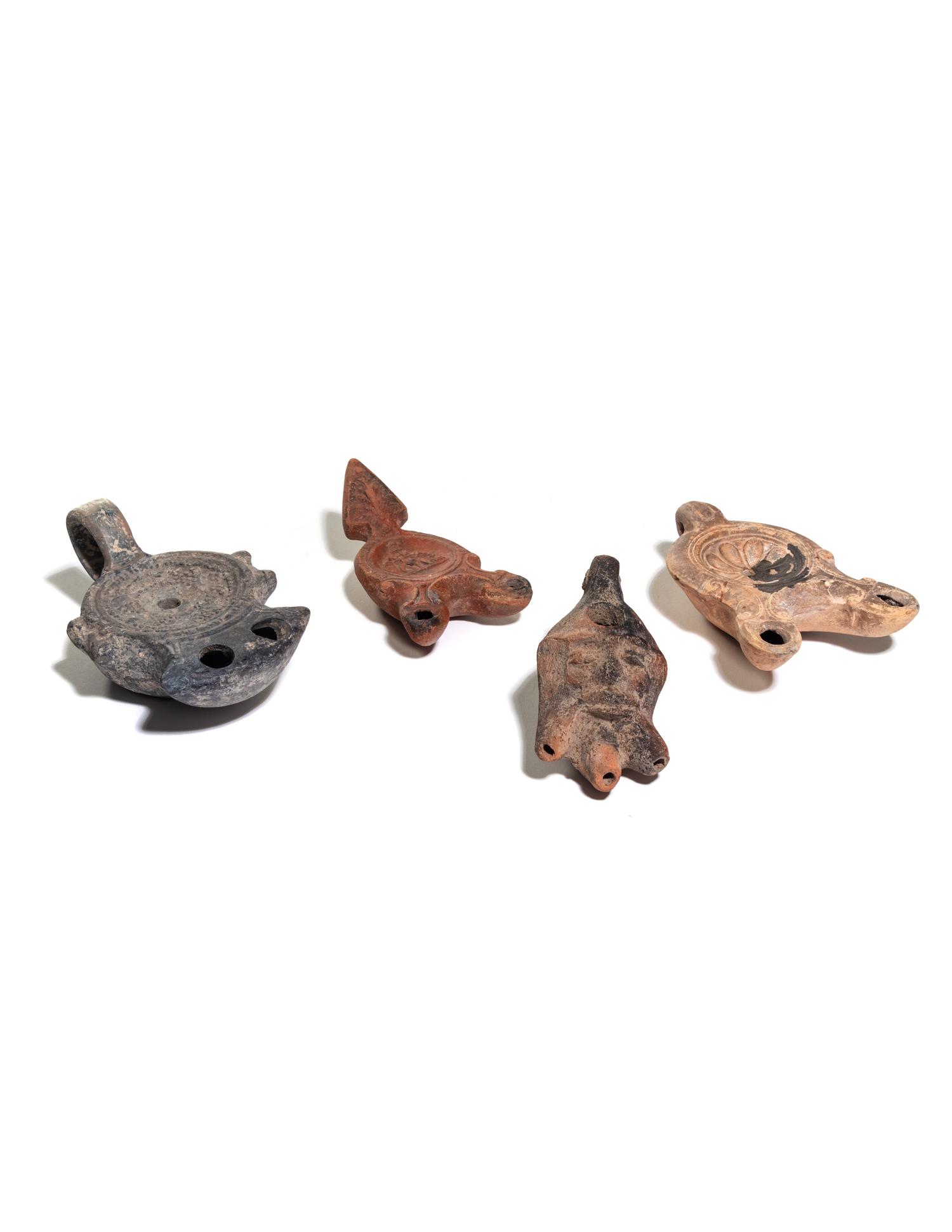 Five Roman Molded Terra Cotta Oil Lamps