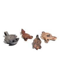 Five Roman Molded Terra Cotta Oil Lamps