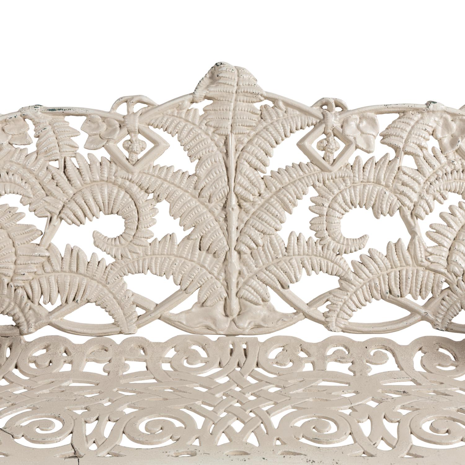 A Four-Piece Cast Iron Garden Seating Suite