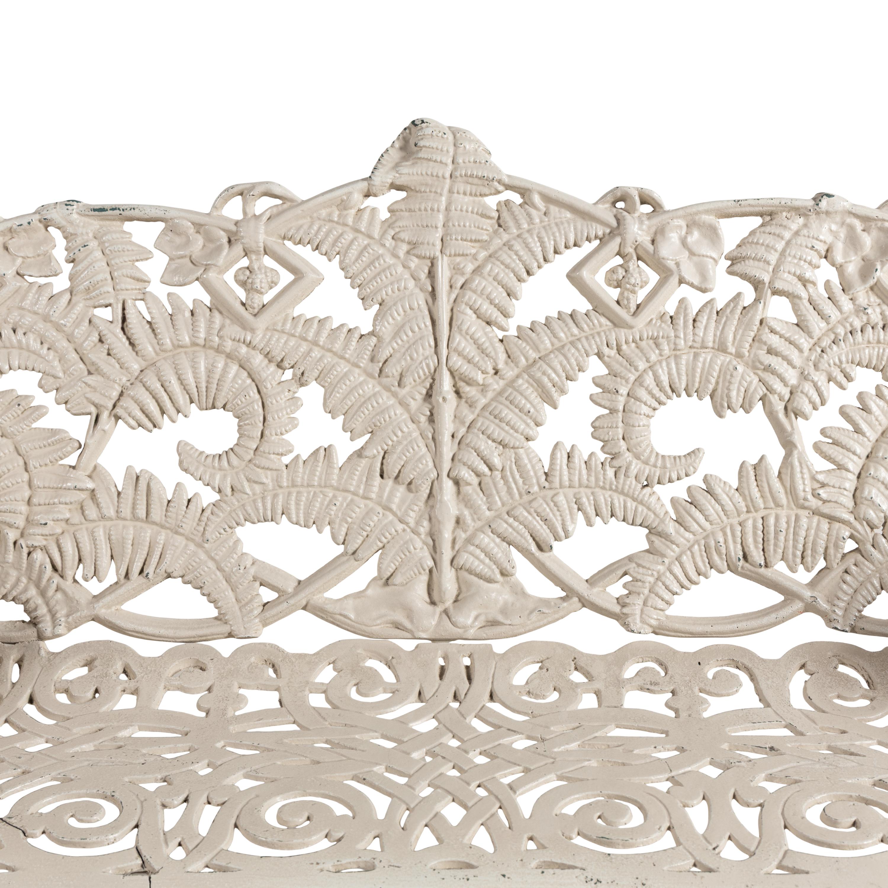 A Four-Piece Cast Iron Garden Seating Suite
