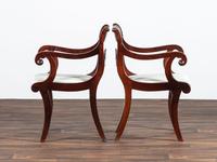 A Pair of Classical Cornucopia Carved Mahogany Armchairs