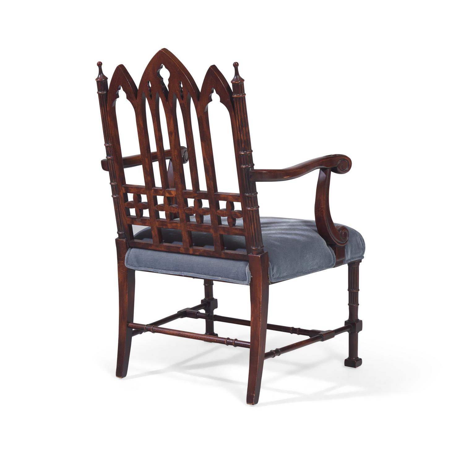 A Gothic Revival Style Carved Oak Armchair