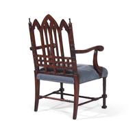 A Gothic Revival Style Carved Oak Armchair