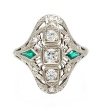 An 18 Karat White Gold, Diamond and Synthetic Emerald Ring, 3.20 dwts.