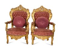 A Pair of Italian Rococo Style Giltwood Armchairs