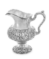 An American Silver Water Pitcher, The Stieff Company, Baltimore, MD, the baluster form body with repousse floral and foliate decoration
