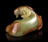 A Russet and White Jade Figure of a Ram