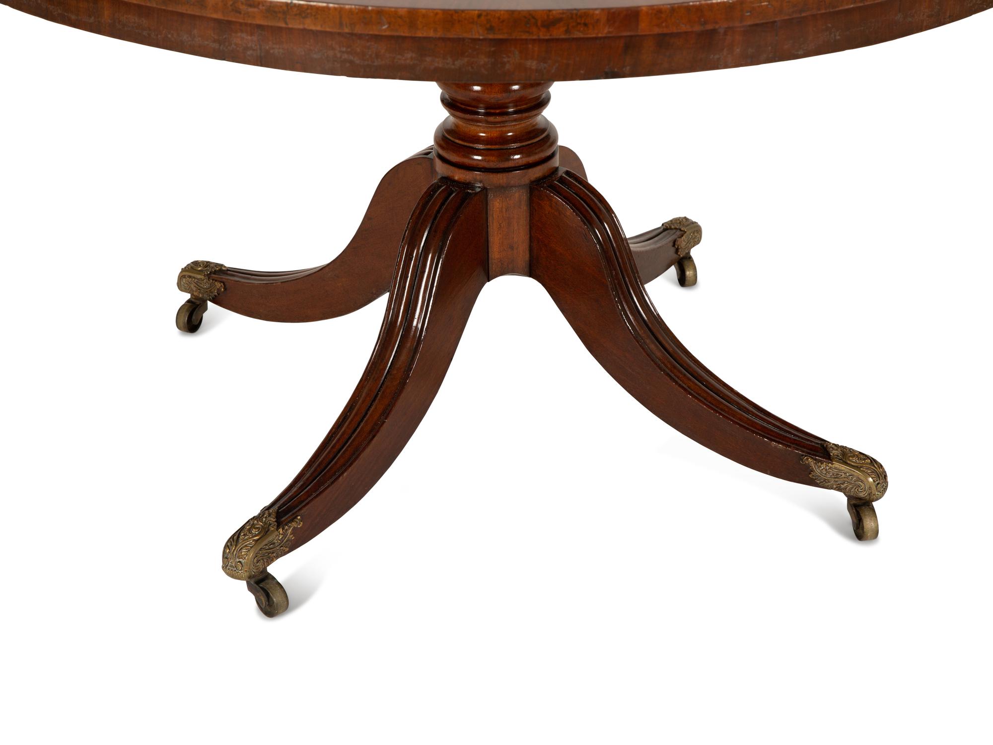 A Regency Figured Mahogany Crossbanded Center Table — 19th Century