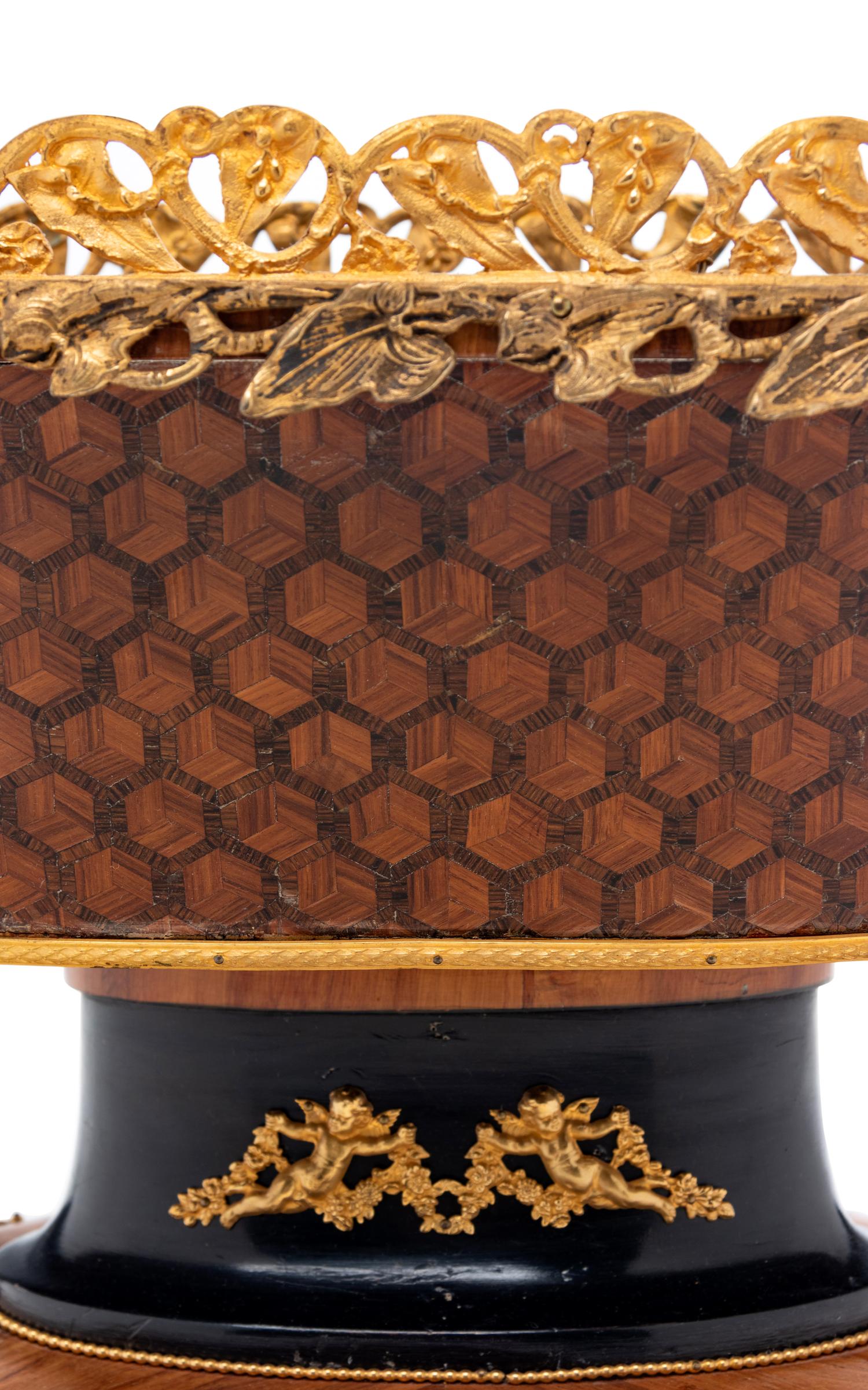 A Napoleon III Gilt Metal Mounted, Parcel Ebonized and Parquetry Jardinière