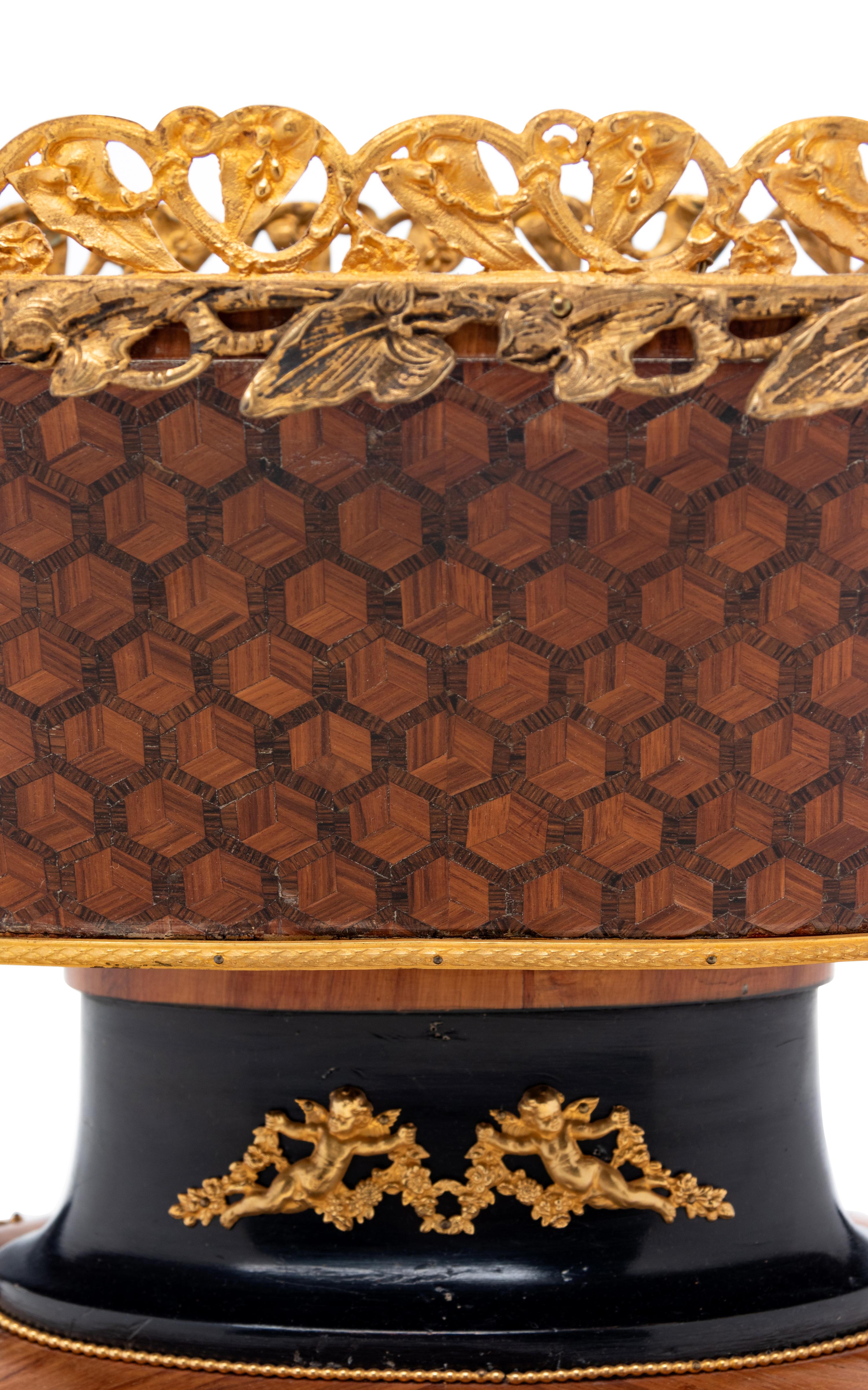 A Napoleon III Gilt Metal Mounted, Parcel Ebonized and Parquetry Jardinière