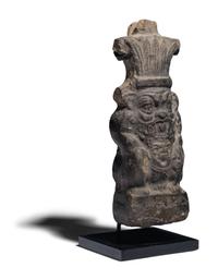 An Egyptian Terracotta Vessel in the form of Bes
