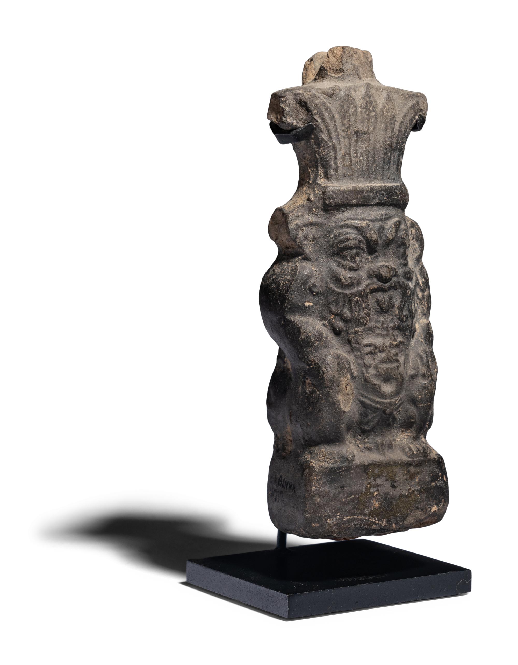An Egyptian Terracotta Vessel in the form of Bes