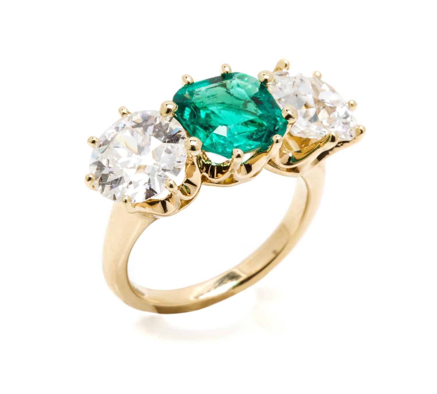 An 18 Karat Gold, Emerald and Diamond Ring, 4.80 dwts.