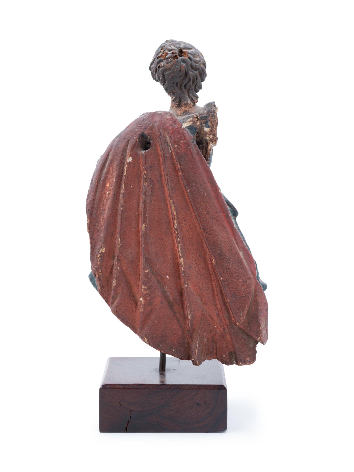 A Continental Carved and Polychromed Santo Figure