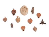 Ten Roman Terracotta Oil Lamps and a Holy Land Pottery Jug