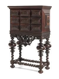 A Portuguese Baroque Style Carved Walnut Cabinet on Stand