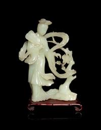 A Chinese Celadon Jade Figure of a Female Immortal