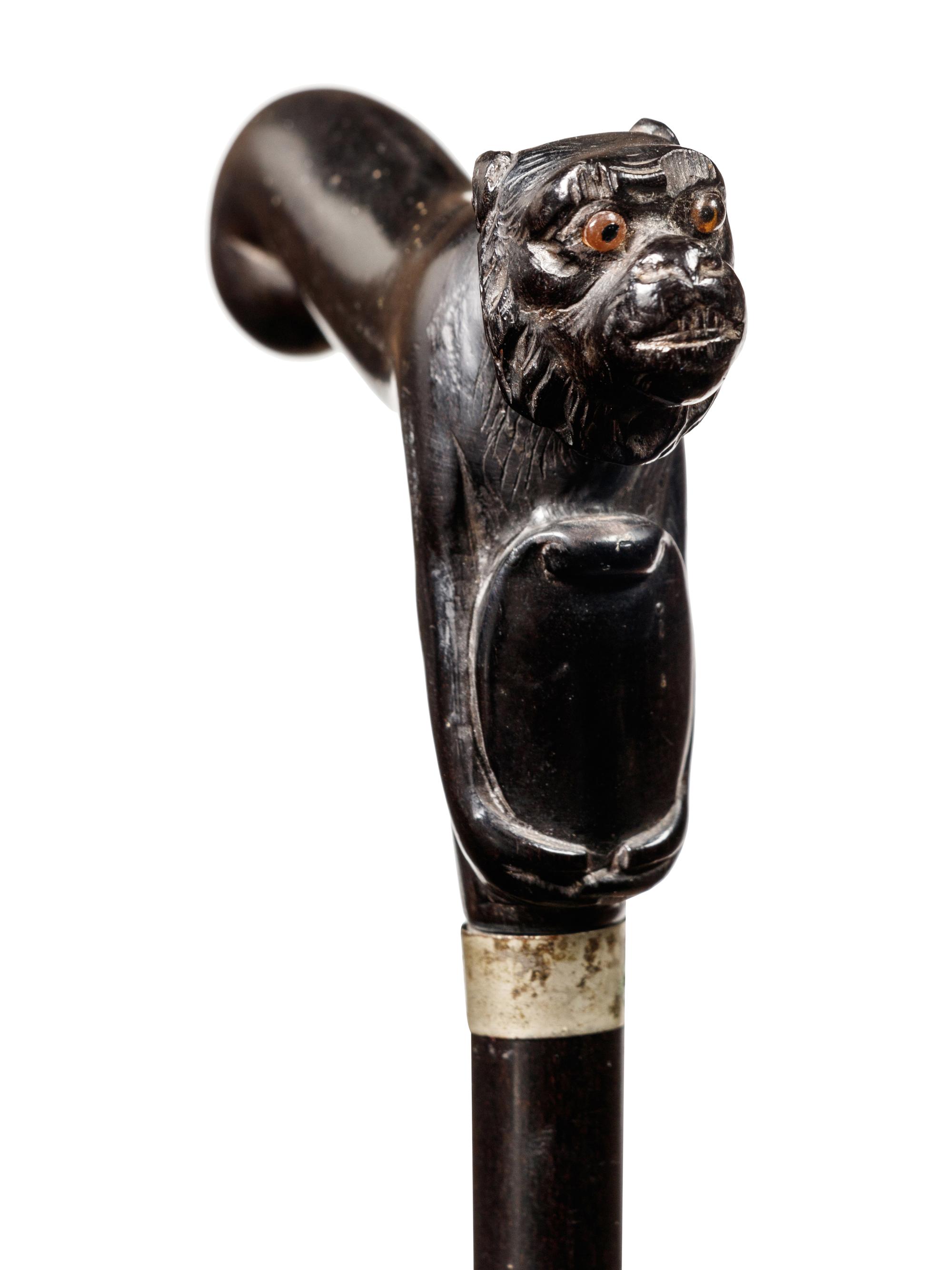 A Continental Carved Ebony Zoomorphic Walking Stick