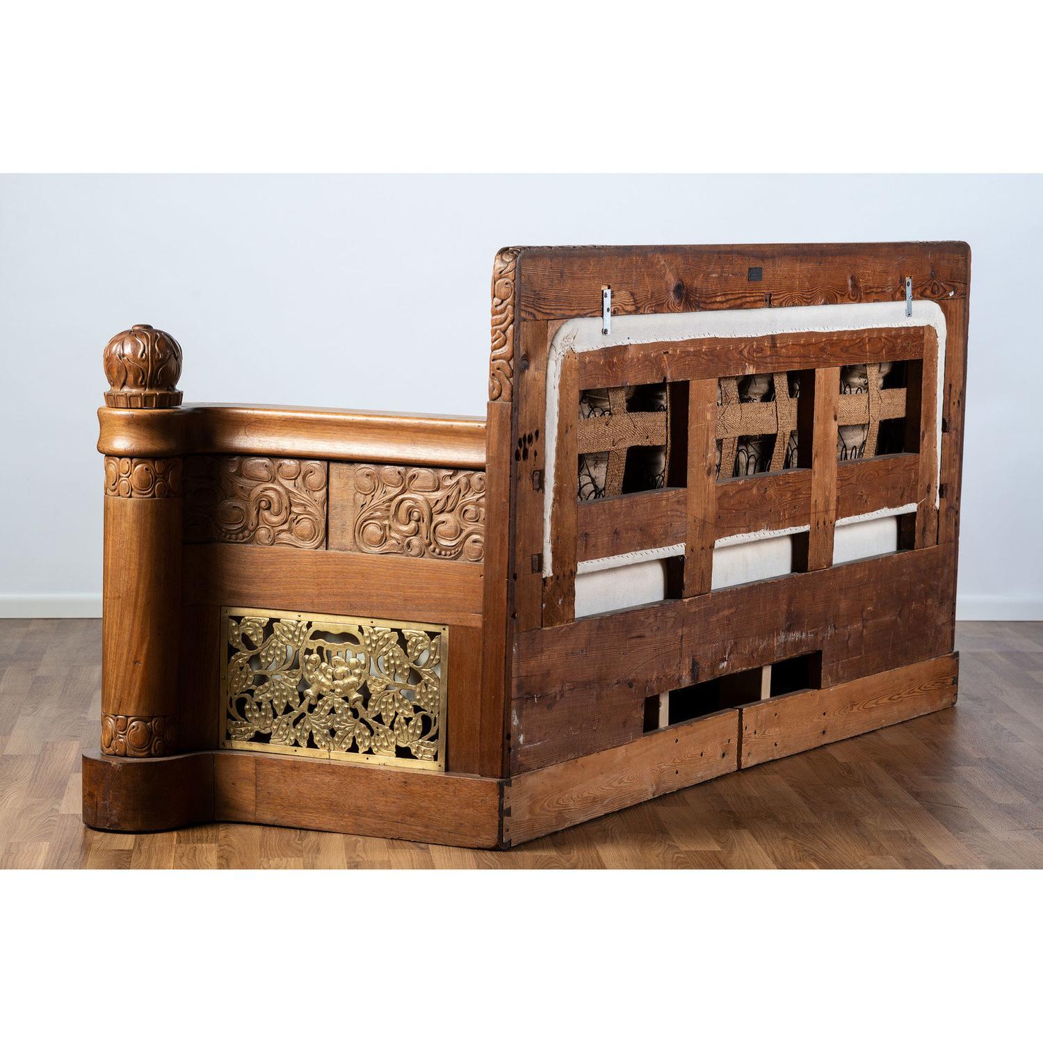 An Art Nouveau Mahogany and Brass Sofa, Attributed to Thorvald Bindesbøll (Danish, 1846-1908)