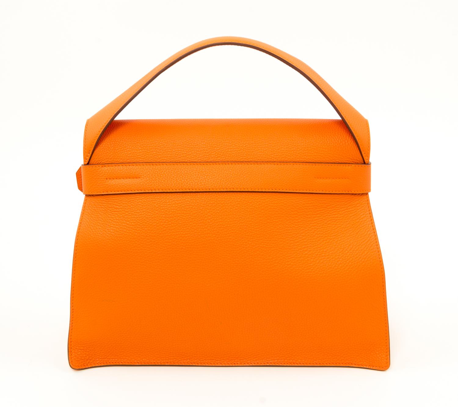 An Hermès Orange Togo Etribelt Handbag, 13.5" x 10.5" x 5"; Handle drop: 3.5".