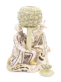 A Nymphenburg Porcelain Group of Figures with an Artichoke as a Perfume Burner