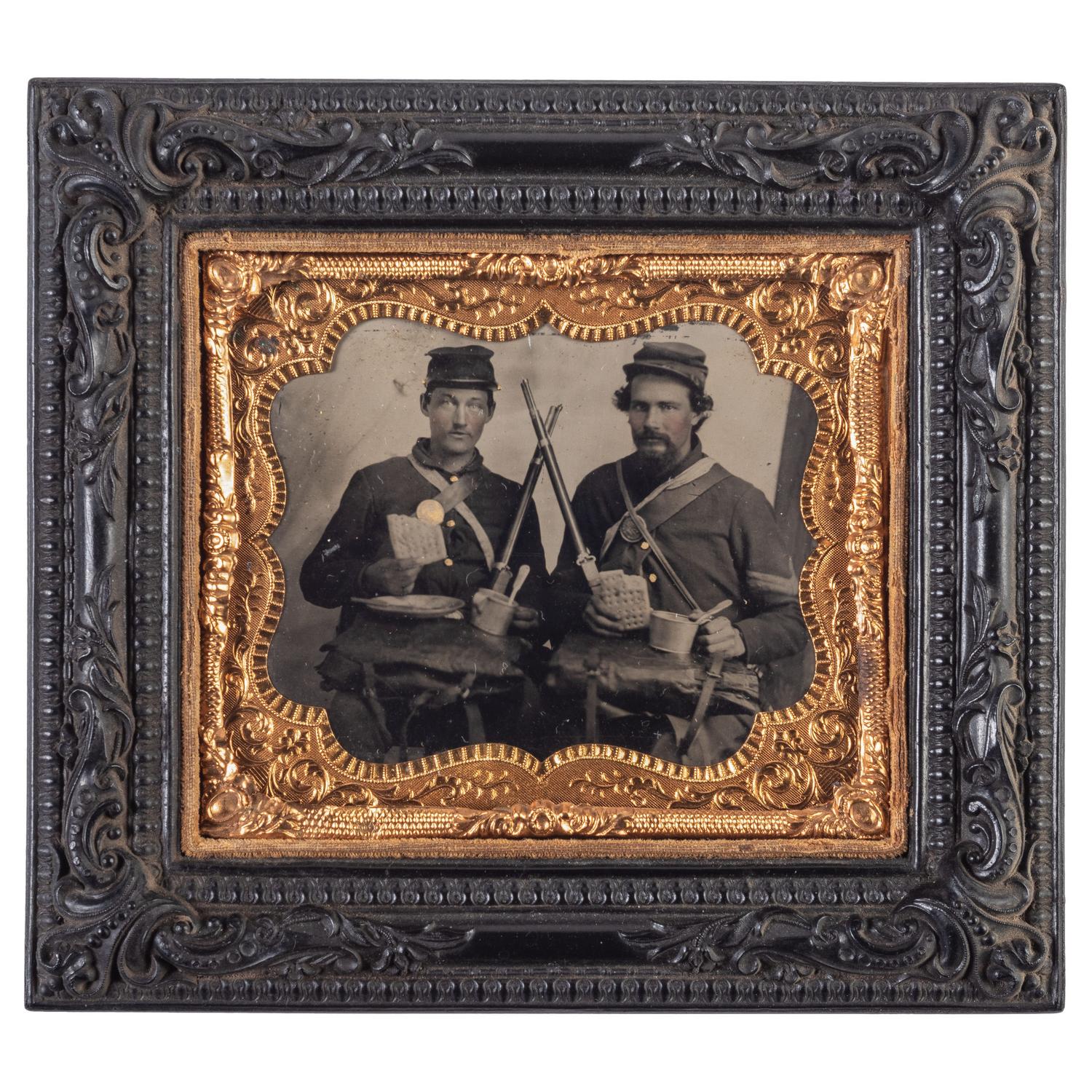 Sixth plate tintype taken in the field featuring Ohio soldiers posed with their rifles, equipment, mess gear, and hardtack.