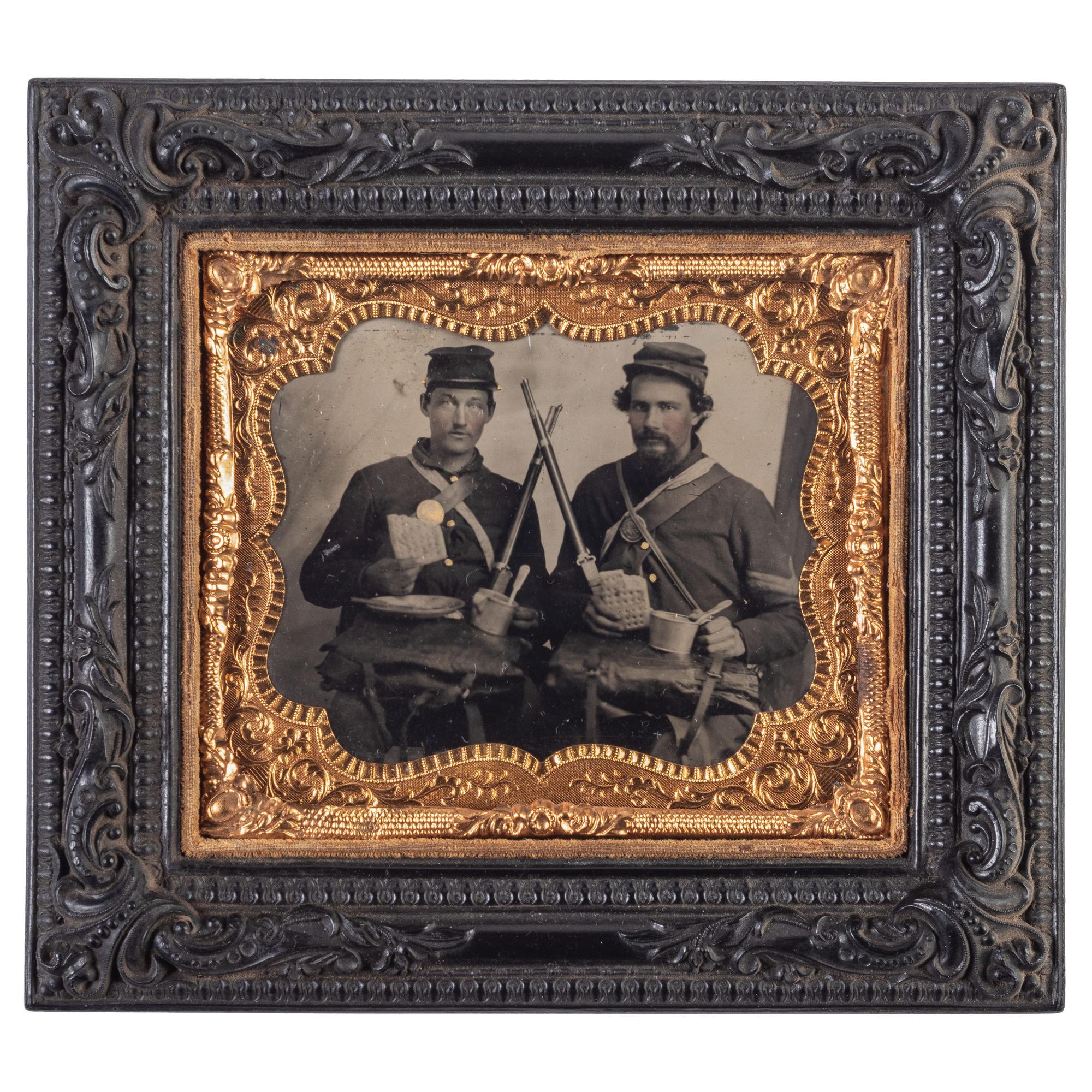 Sixth plate tintype taken in the field featuring Ohio soldiers posed with their rifles, equipment, mess gear, and hardtack.