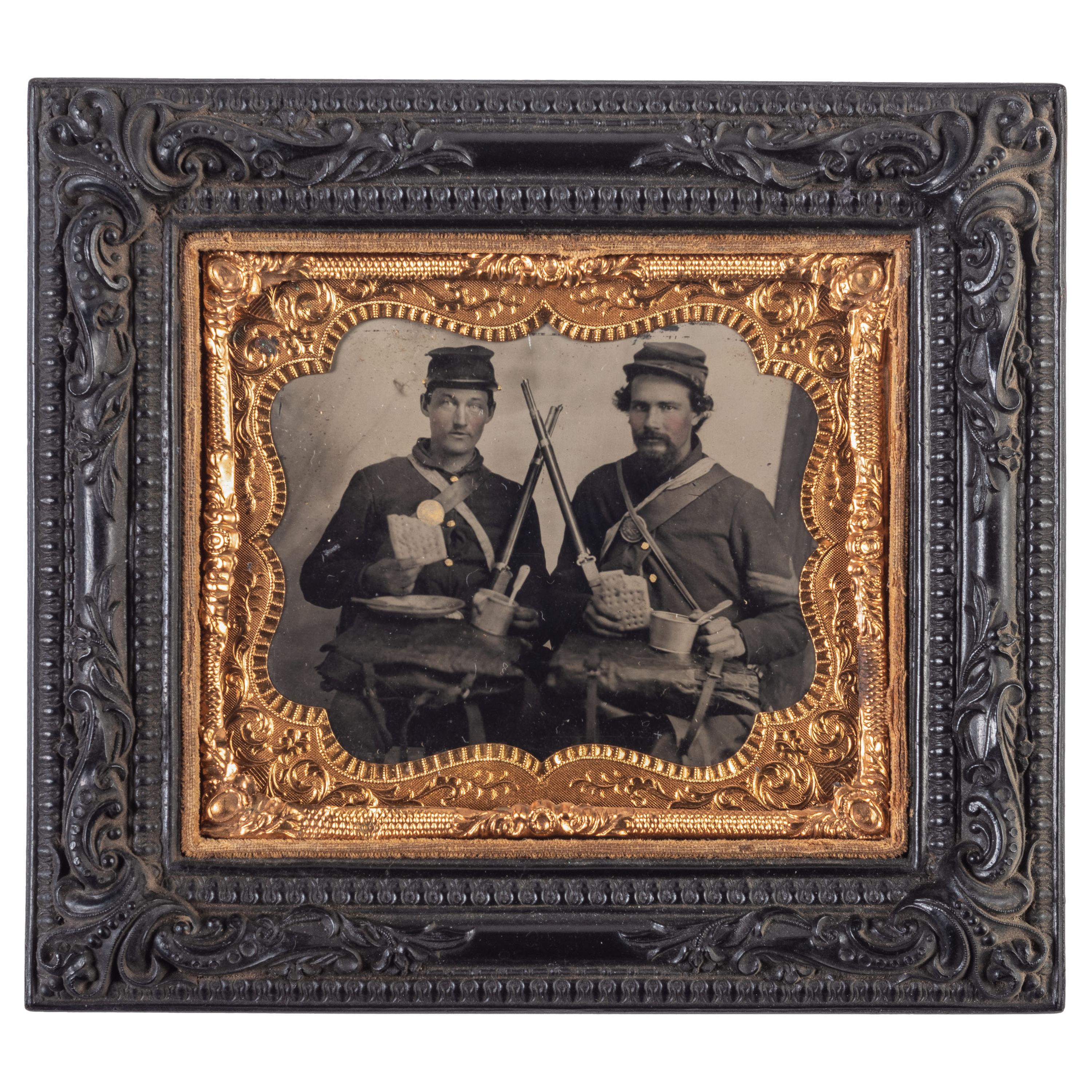 Sixth plate tintype taken in the field featuring Ohio soldiers posed with their rifles, equipment, mess gear, and hardtack.