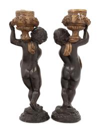 A Pair of Gilt and Patinated Bronze Figures of Cherubs