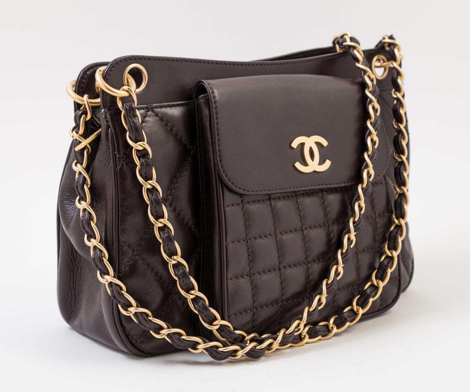 A Chanel Brown Leather Quilted Handbag, 12" x 8" x 3.5"; Strap drop: 10".