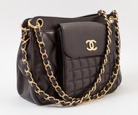 A Chanel Brown Leather Quilted Handbag, 12" x 8" x 3.5"; Strap drop: 10".